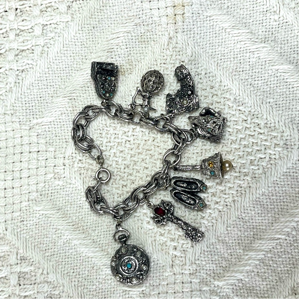 Vintage Silver Charm Bracelet with Intricate Details